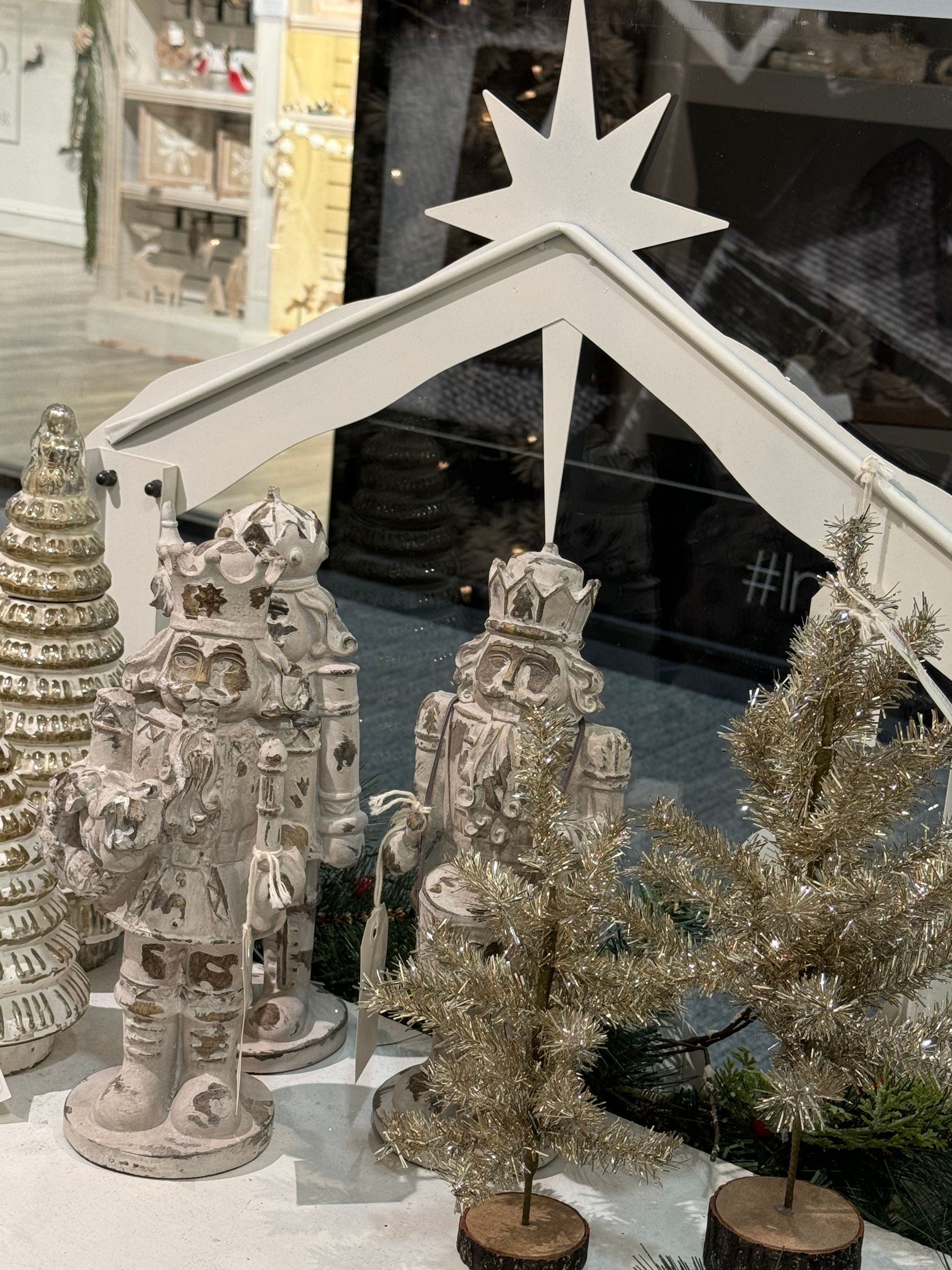 A nativity scene with a star on top of it
