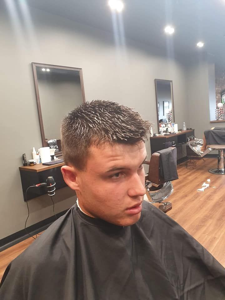 Man In Barber Chair With Short Haircut β Bolton Brothers Barbers in Erina, NSW