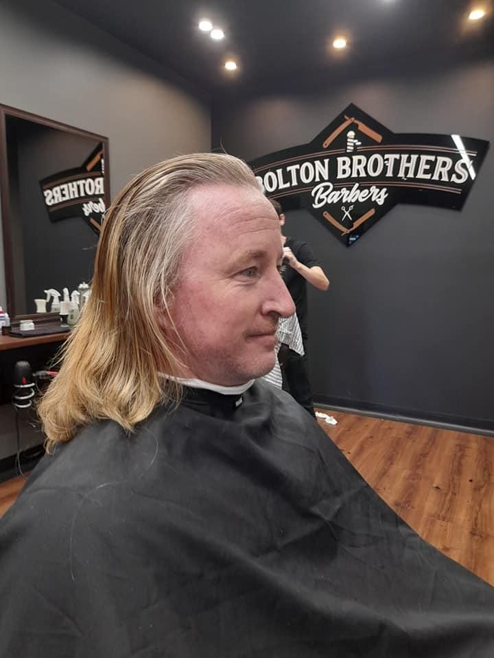 Man With Long Wet Hair Facing Right — Bolton Brothers Barbers in Erina, NSW