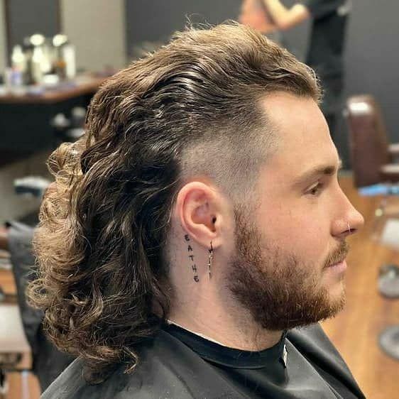 Man With Mullet Hairstyle And Shaved Sides — Bolton Brothers Barbers in Erina, NSW