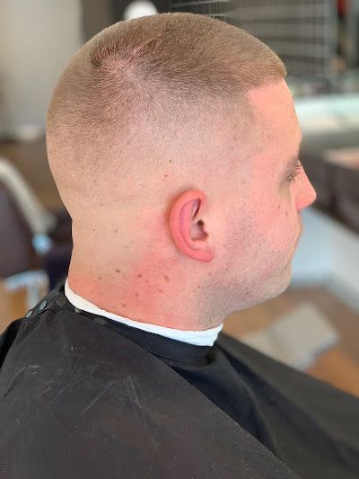 Man With Short Faded Haircut In Profile View — Bolton Brothers Barbers in Erina, NSW