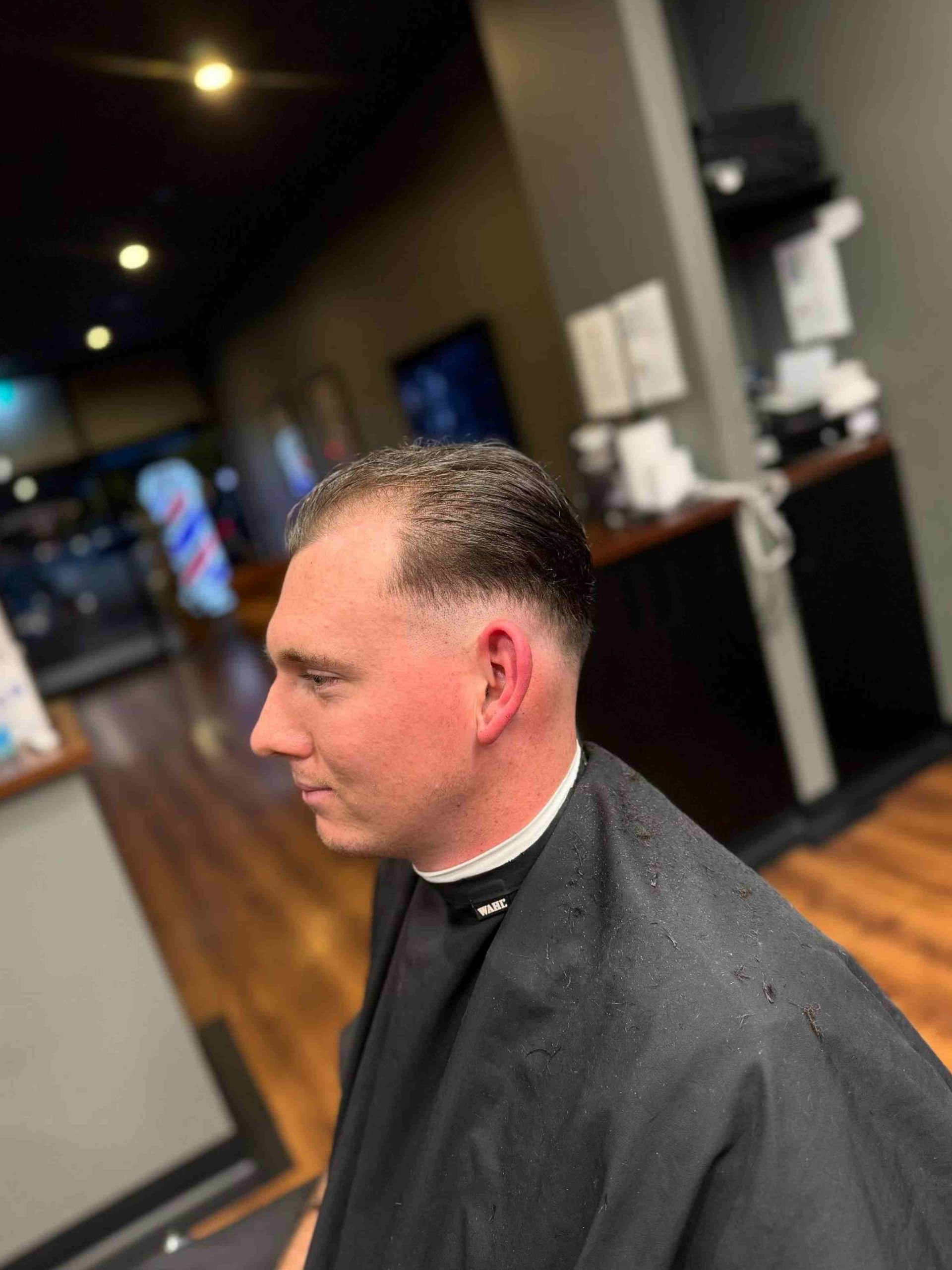 Man With Fade Haircut And Shaved Neckline — Bolton Brothers Barbers in Erina, NSW