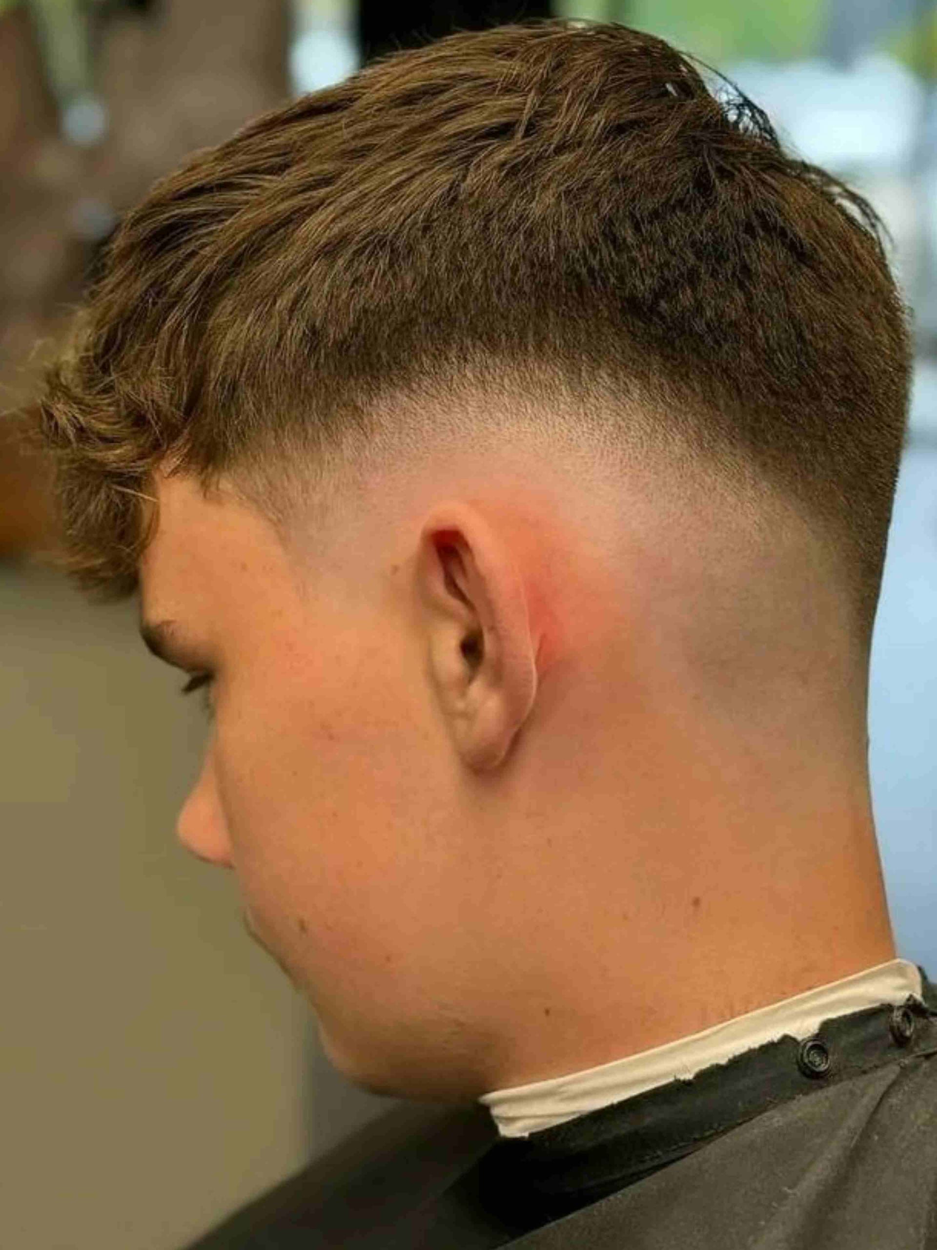 Teenager With Faded Haircut And Brown Hair — Bolton Brothers Barbers in Erina, NSW