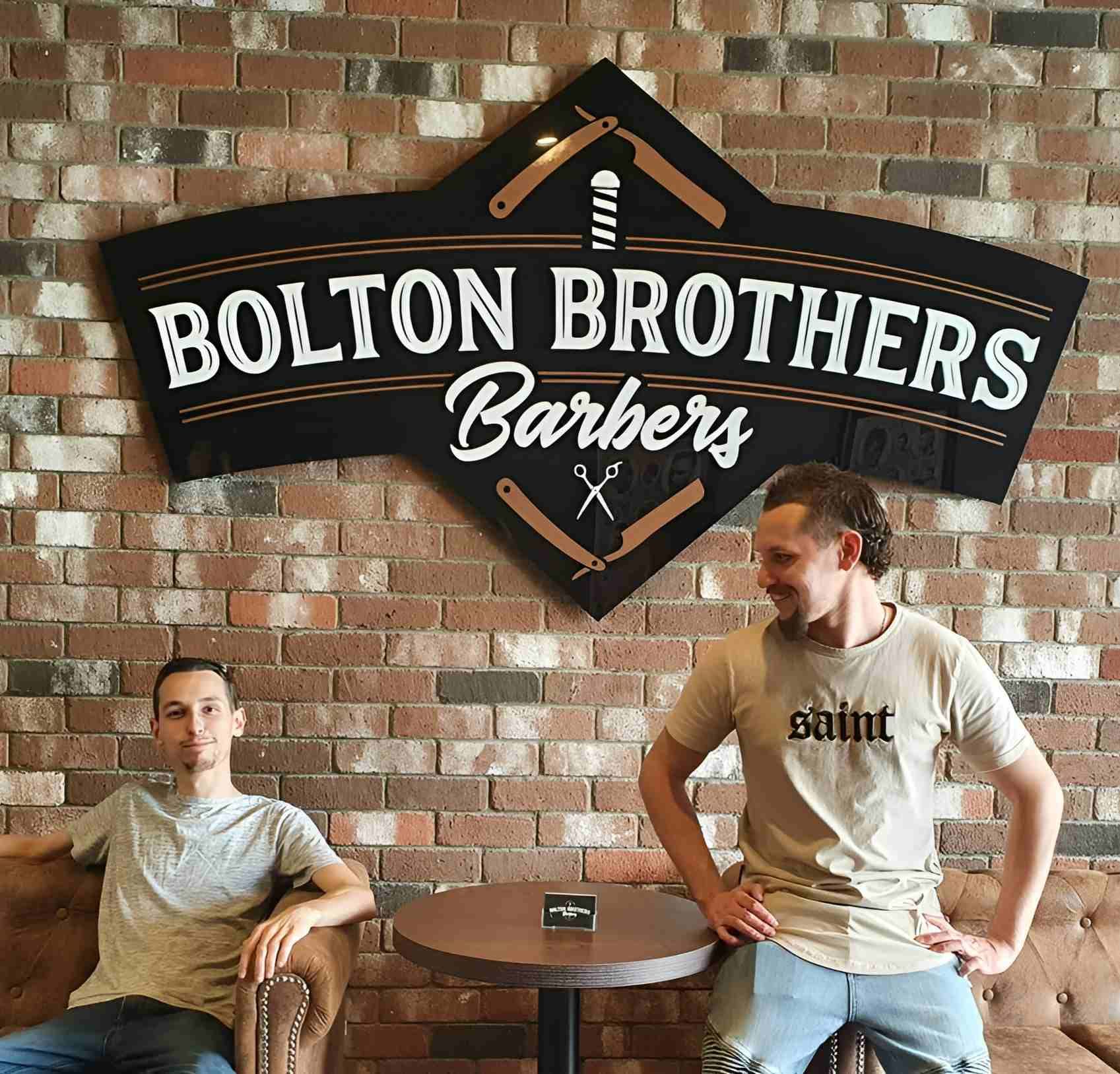 Two Men In Front Of Bolton Brothers Sign β Bolton Brothers Barbers in Erina, NSW