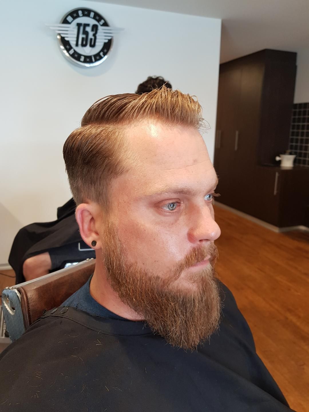 Man With Blonde Hair And Beard Getting Haircut — Bolton Brothers Barbers in Erina, NSW