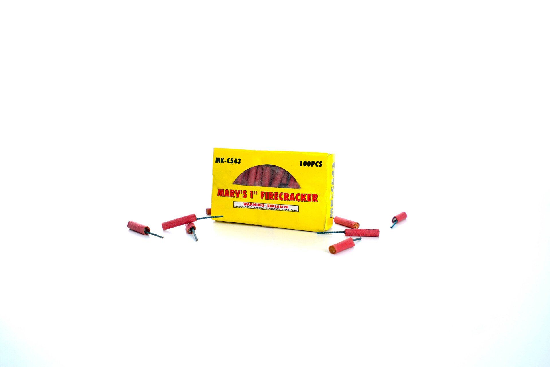 A box of fireworks is sitting on a white surface.