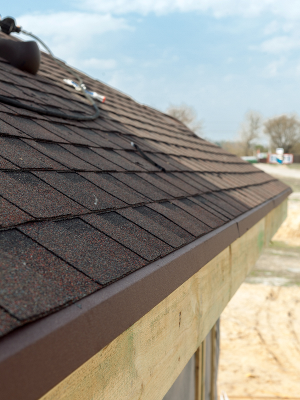 A close up of a roof with shingles on it