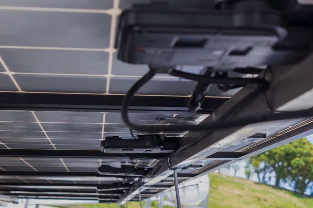 A Bunch Of Solar Panels Are Sitting On Top Of Each Other On A Roof — Trusted Energy Solutions In Everton Hills, QLD