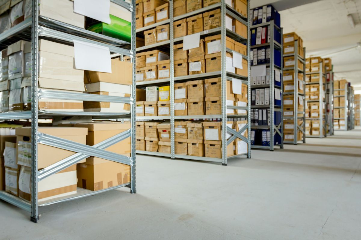 A Warehouse Filled With Lots of Shelves and Boxes — Ocean Grove Removals In Whittington, VIC