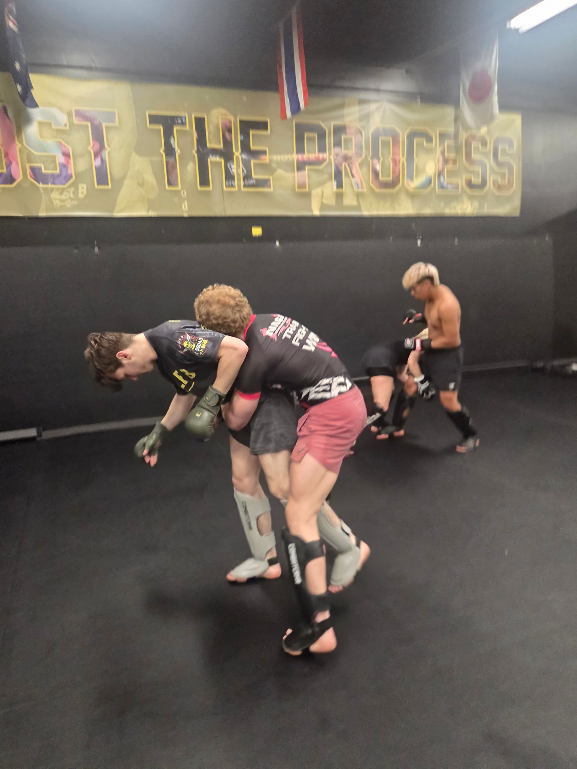 Adults practicing MMA drills at Killer B Combat Academy in Oakhurst, NJ, building fitness.