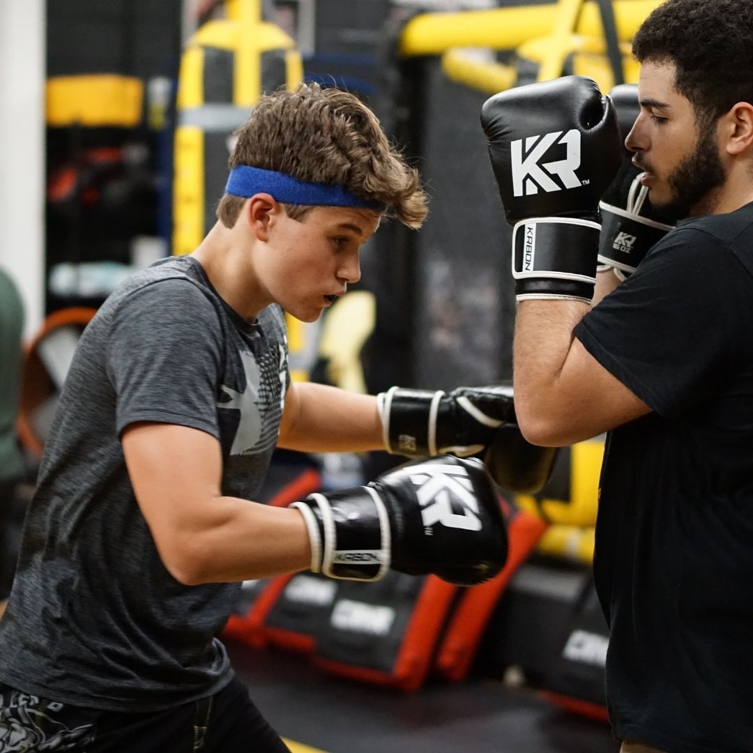 Students train striking and grappling at Killer B Combat Academy in Oakhurst, NJ, building confidence and fitness.