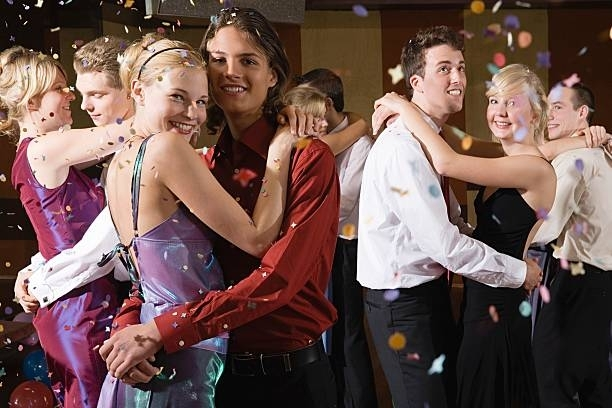 A Group Of People Are Dancing At A Prom Party — Pittsfield, MA — Black Luxe Luxury Car