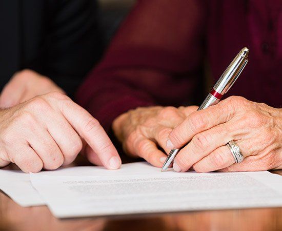Signing A Document — Lake City, FL — Lloyd E. Peterson Jr., Sandra H. Peterson, Attorneys At Law Signing A Document — Lake City, FL — Lloyd E. Peterson Jr., Sandra H. Peterson, Attorneys At Law