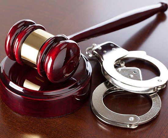 Gavel And Handcuffs — Lake City, FL — Lloyd E. Peterson Jr., Sandra H. Peterson, Attorneys At Law Gavel And Handcuffs — Lake City, FL — Lloyd E. Peterson Jr., Sandra H. Peterson, Attorneys At Law