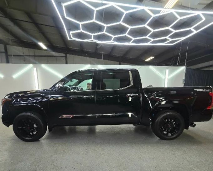 Black truck with window tint by CM3 Detailing Studio & Ceramic Coating in Elgin, IL