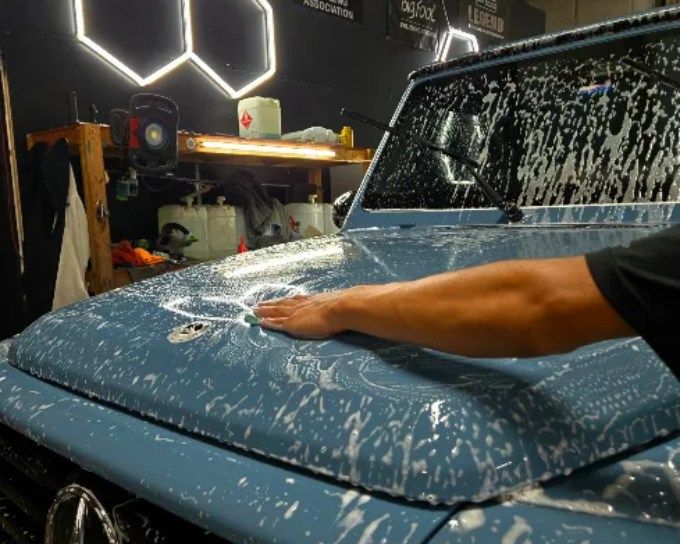 Blue hood getting paint protection film at CM3 Detailing Studio & Ceramic Coating in Elgin, IL