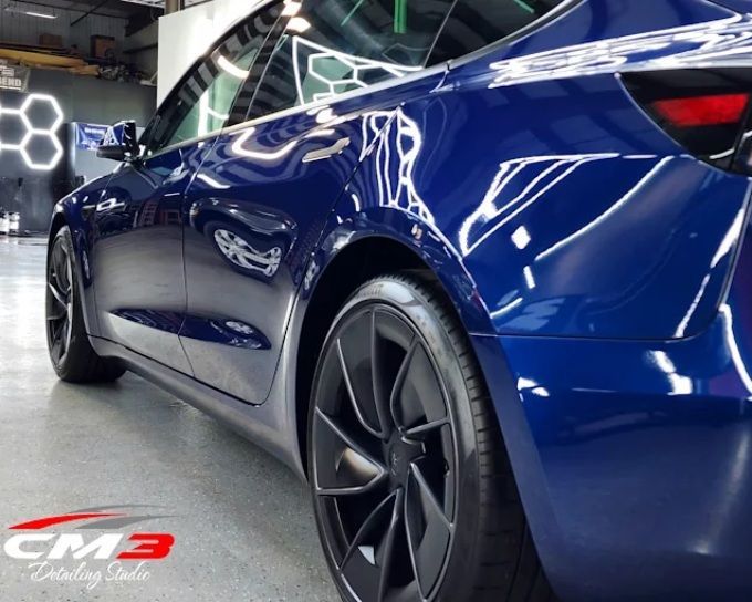 Blue sports car with a glossy ceramic coating at CM3 Detailing Studio & Ceramic Coating in Elgin, IL
