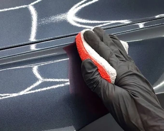 Ceramic coating applied by hand to a dark panel at CM3 Detailing Studio & Ceramic Coating in Elgin, IL