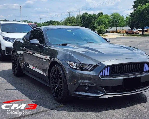 Gray sports car with window tint by CM3 Detailing Studio & Ceramic Coating in Elgin, IL