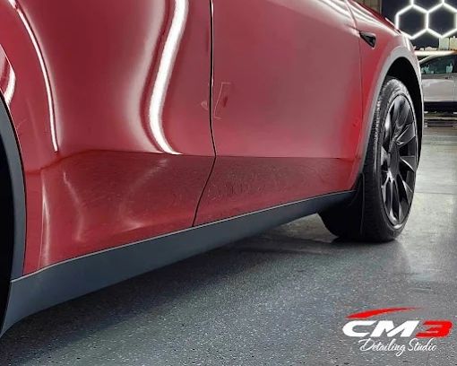 Red SUV with paint protection film by CM3 Detailing Studio & Ceramic Coating in Elgin, IL