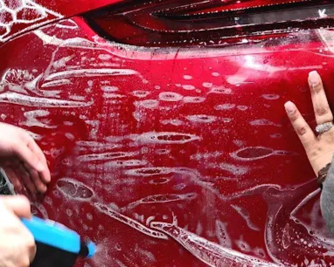 Red panel getting paint protection film at CM3 Detailing Studio & Ceramic Coating in Elgin, IL