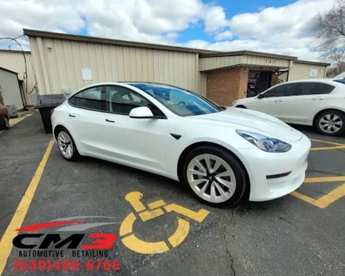 White sedan with window tint by CM3 Detailing Studio & Ceramic Coating in Elgin, IL