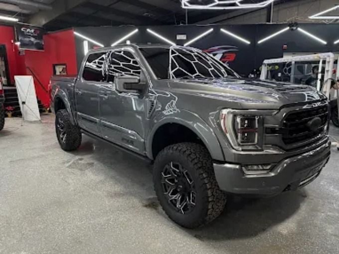 Gray Ford F-150 Tremor inside a shop with a fresh ceramic coating on the exterior