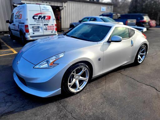 Silver Nissan 370Z with window tint installation parked outside CM3 Automotive Detailing