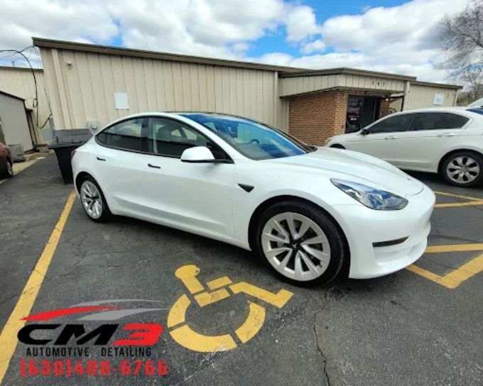 White sedan with window tint by CM3 Detailing Studio & Ceramic Coating in Elgin, IL
