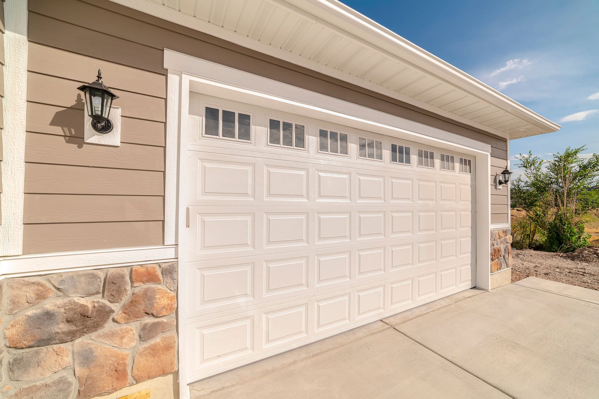 House with Beige Garage Doors — Dearborn, MI — Doors Are Us