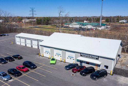 Outside of our shop with cars parked in front | Eurocharged