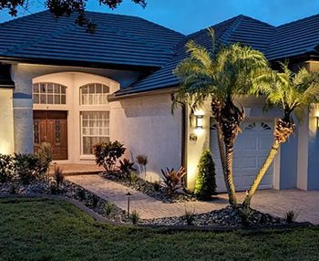 A house with a palm tree in front of it