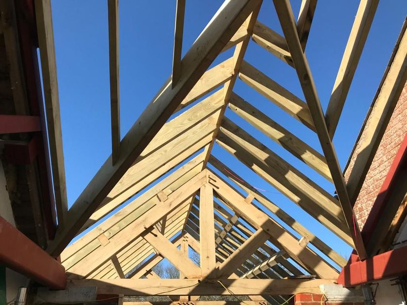 Looking up at the roof of a building under construction.