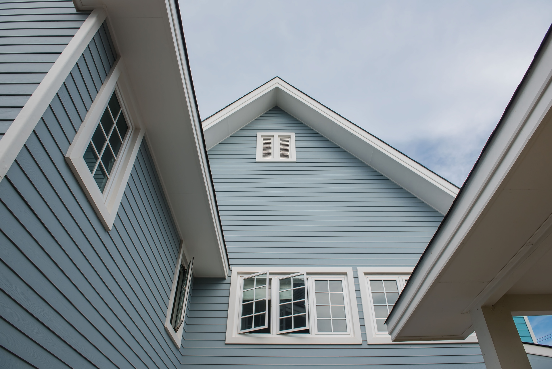 Looking up at the roof of a blue house