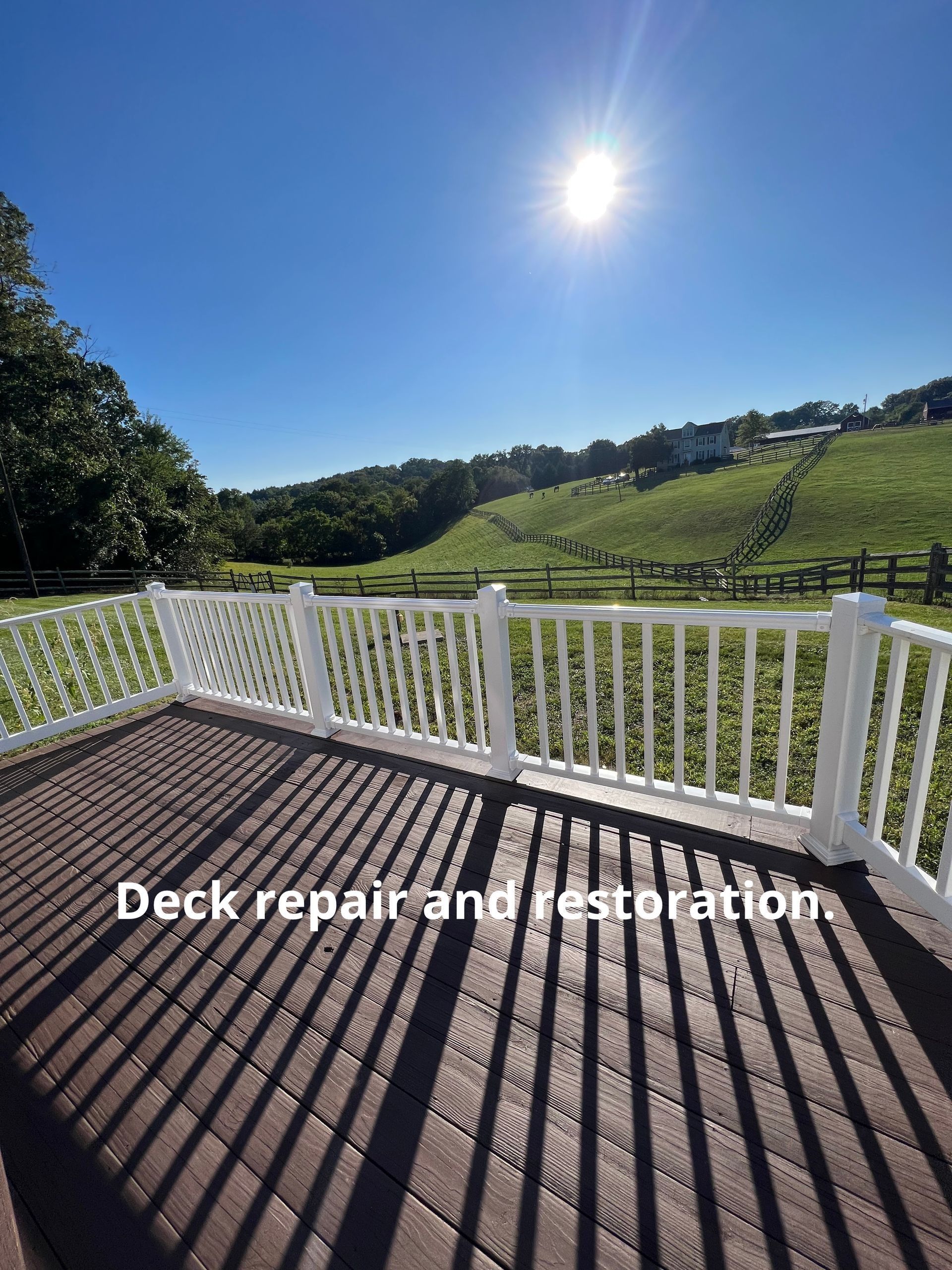 Sunny deck with white railing overlooking green hills, with text “Deck repair and restoration”