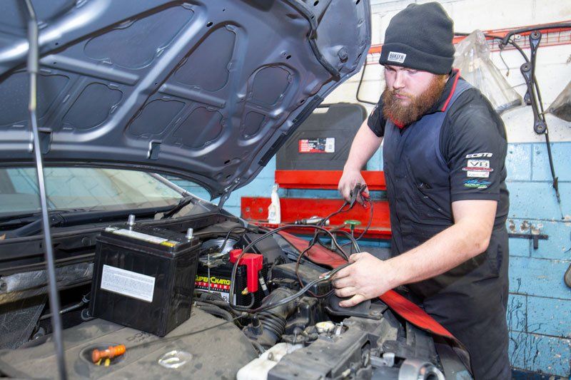 A Man Repairing A Car - Adelaide, SA - Silver’s Auto Centre A Man Repairing A Car - Adelaide, SA - Silver’s Auto Centre