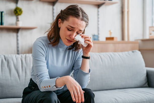 Sad wife missing her husband on the bed — Mental Health Condition Treatment in Pittsburgh, PA