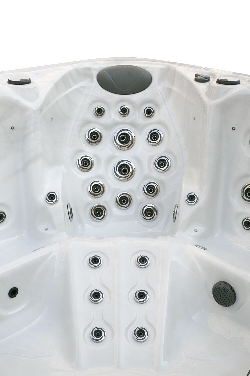 Close-up view of white hot tub interior with numerous water jets and seating areas.