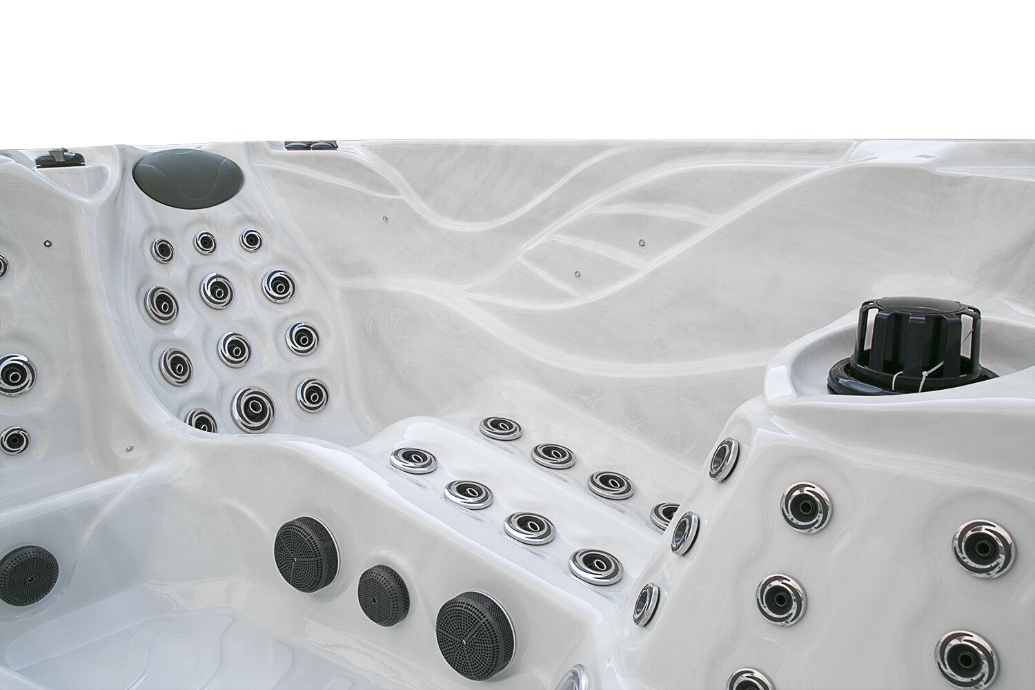 White hot tub interior with multiple jet nozzles and a control knob.