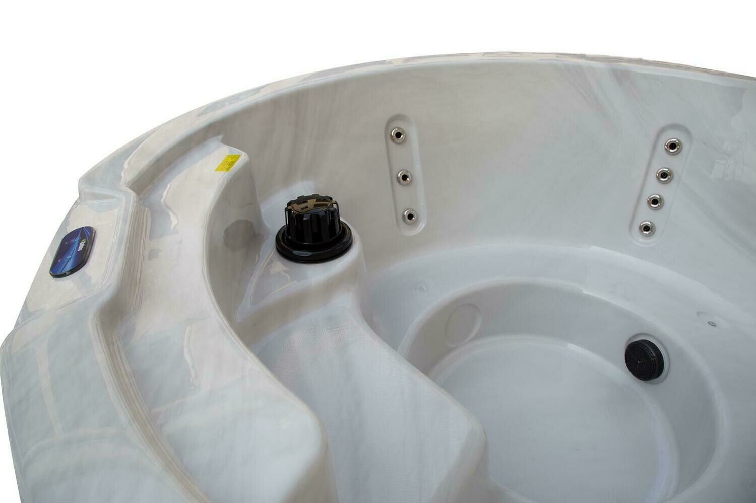 Close-up view of a white and gray hot tub interior with a black control knob and water jets.