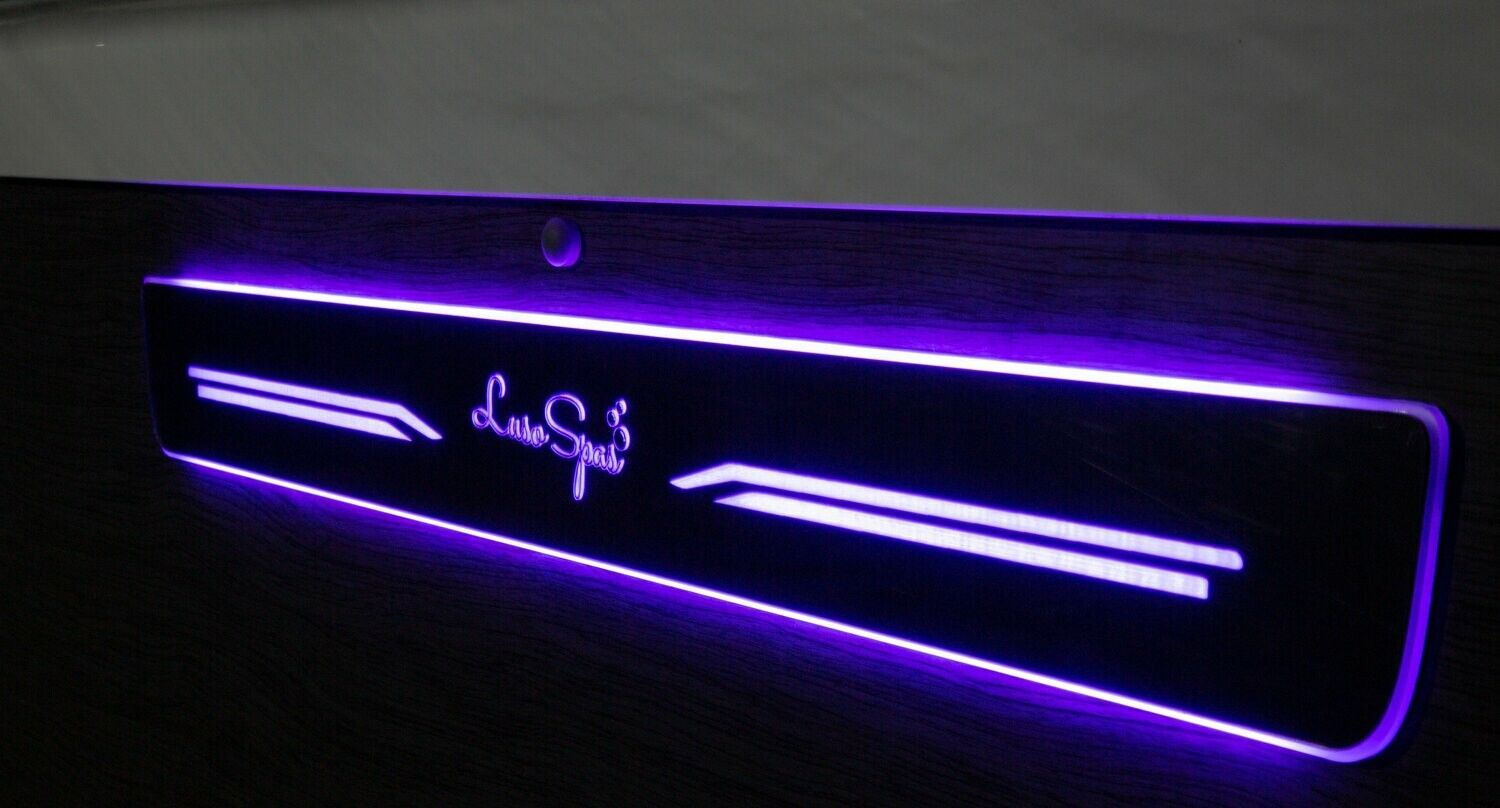 Purple-lit car door sill with 