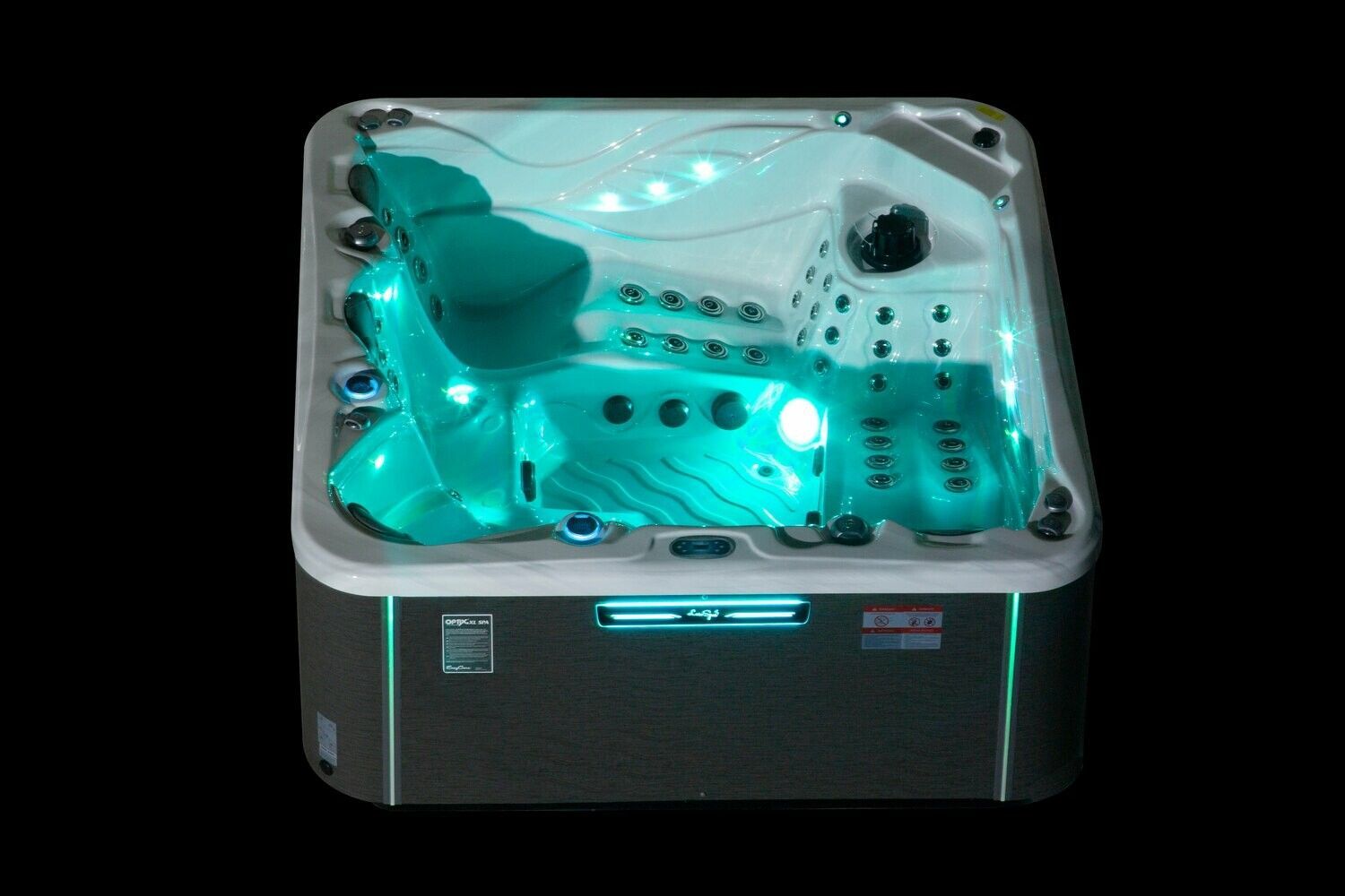Lit-up, turquoise hot tub with multiple jets, seats, and a control panel, on a black background.