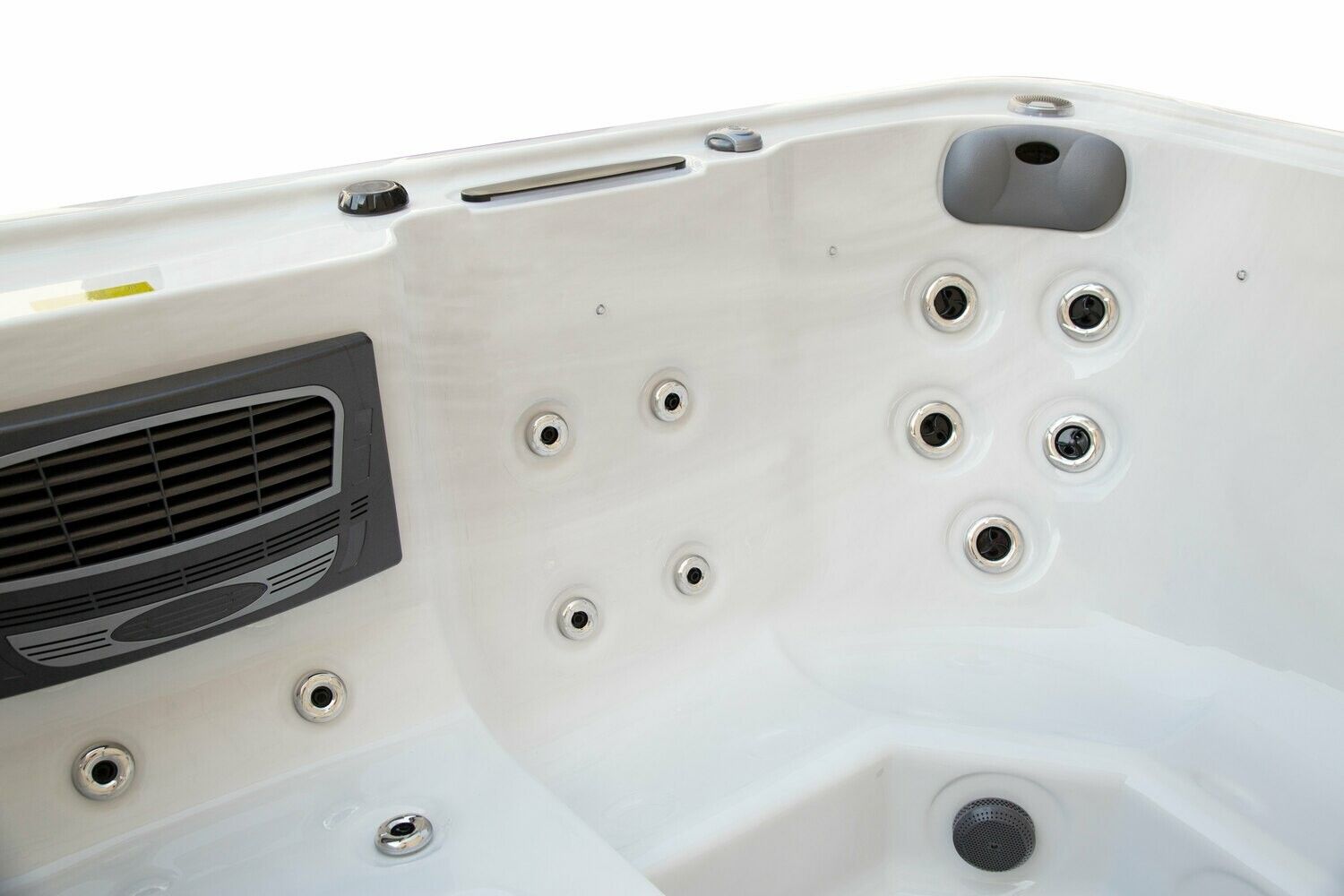 White hot tub interior with jets and control panel.