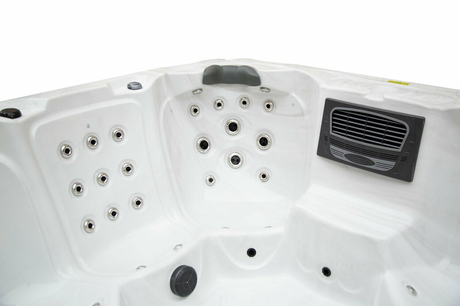 White hot tub interior with multiple jets, headrest, and control panel.