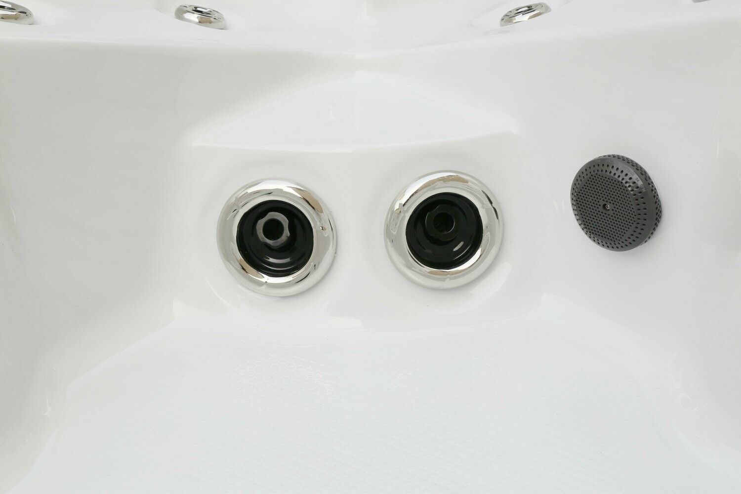 Close-up of a white hot tub interior, featuring two metallic jets and a speaker on the side.