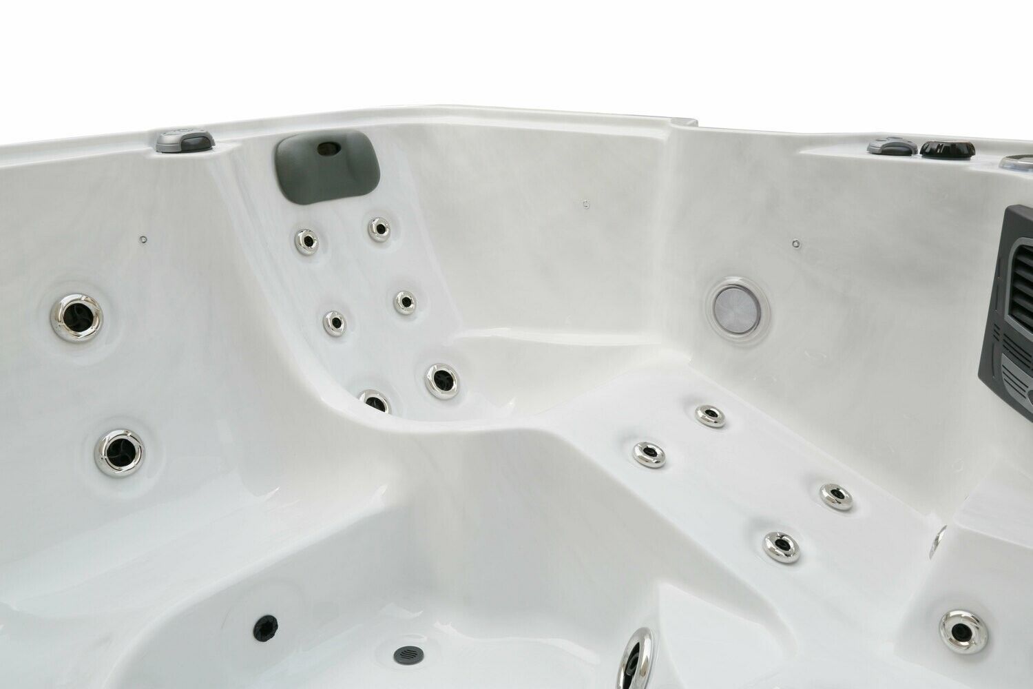 Interior view of a white hot tub with multiple jets and seating areas.