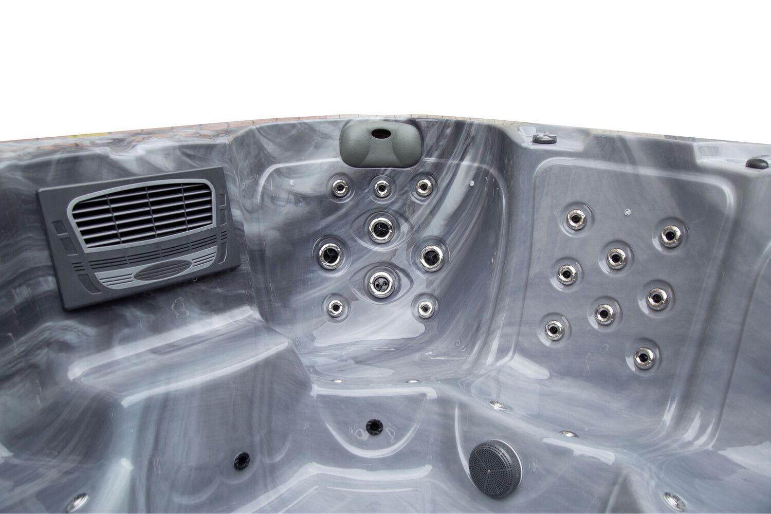 Close-up view of a gray and white marbled hot tub interior with multiple jet nozzles and a vent.
