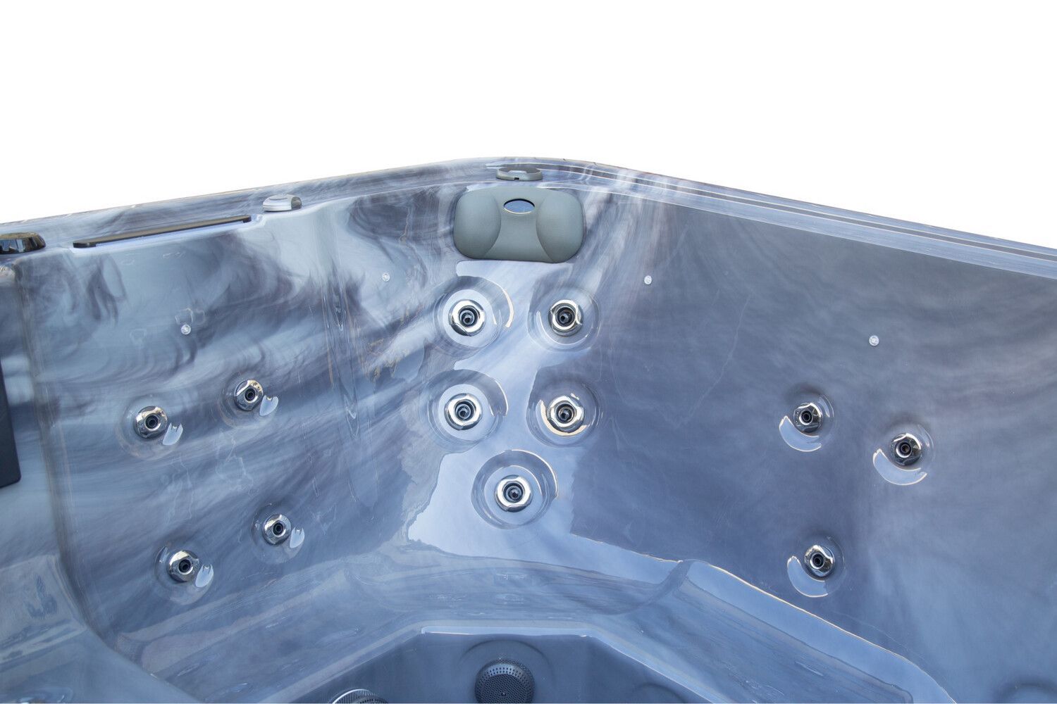 Inside of a gray and white marble patterned hot tub with multiple jet nozzles.