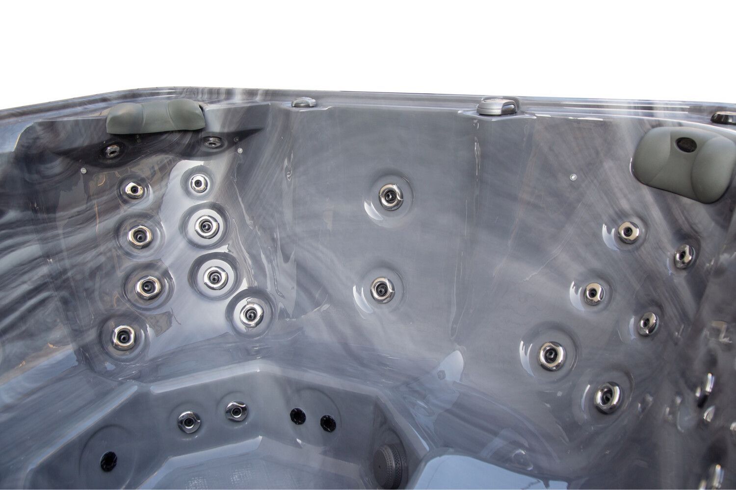 Close-up of a dark grey marbled hot tub interior with several water jets.