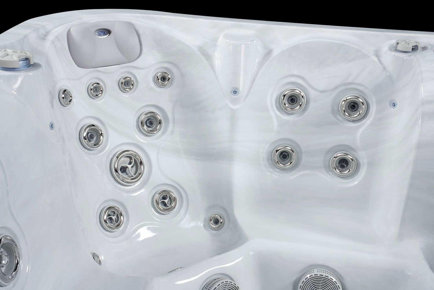 White hot tub interior with multiple jets.